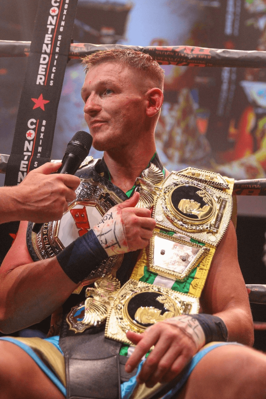 Barrie Jones photographed with his belts while doing an interview.